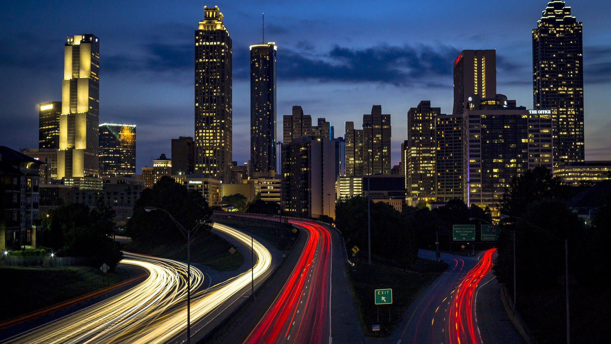 Jackson Street Bridge dusk view of Downtown Atlanta skyline (191 Peachtree Tower, SunTrust Plaza, Bank of America Plaza pyramid spire) with I-75/85 Downtown Con